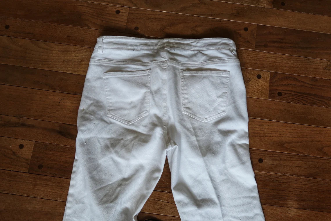 White and black lace up jeans, size Medium.